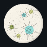 Iconic Atomic Starbursts Round Magnet<br><div class="desc">This Iconic Atomic Starbursts Round Magnet pattern features iconic atomic starbursts. That’s right! The old school, cream coloured background with gold speckles is the perfect backdrop for the vibrant turquoise, soothing celery, and kitschy pear green coloured circles. The spots of colour are sporadically placed in various sizes with overlaying black...</div>