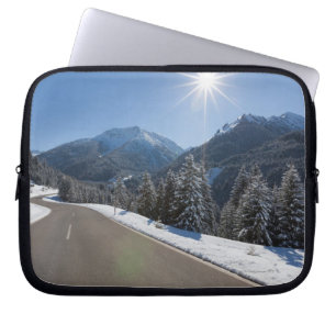 Idyllic empty road thrugh a winter landscape, 2 laptop sleeve
