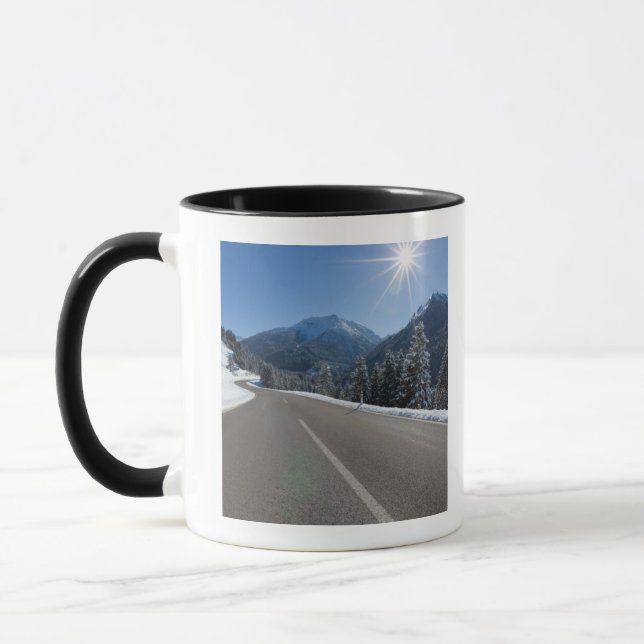 Idyllic empty road thrugh a winter landscape, mug (Left)