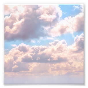 Illuminated pink fluffy clouds in a blue sky photo print
