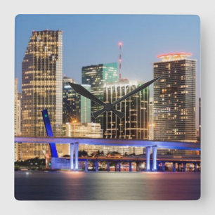 Illuminated skyline of downtown Miami at dusk Square Wall Clock