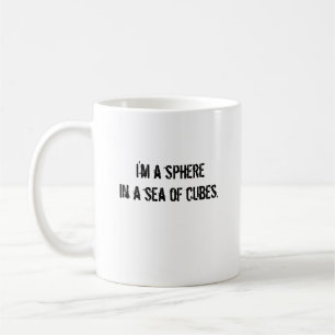 I'm a spherein a sea of cubes. coffee mug