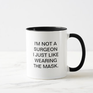 I'M NOT A SURGEON I JUST LIKE WEARING THE MASK MUG