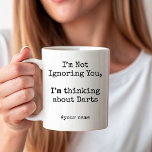I'm Not Ignoring You, Im thinking about Darts Coffee Mug<br><div class="desc">Add some playful humor to your day with the I’m Not Ignoring You,  I’m Thinking About Darts” Coffee Mug. Perfect for dart lovers and game-night fans,  this mug says it all while you enjoy your favorite drink. A fun gift for anyone whose aim is always on the board!</div>