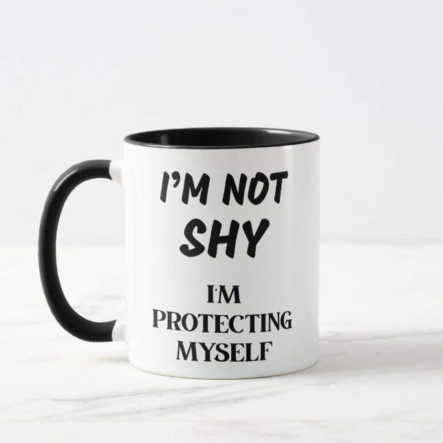 I'M NOT SHY, I'M PROTECTING MYSELF MUG (Left)