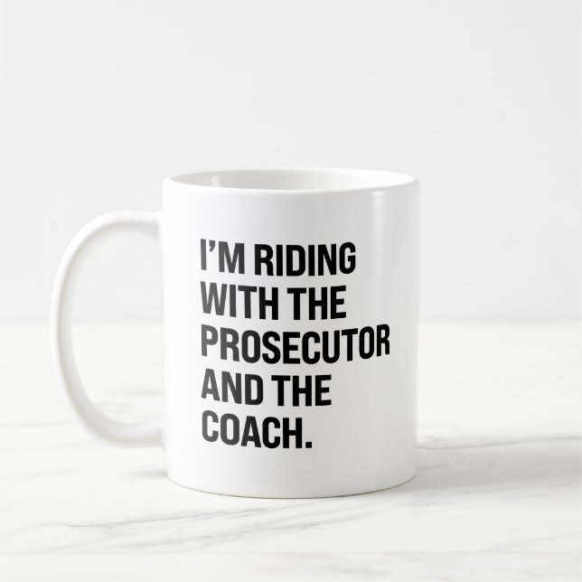 I'm riding with the prosecutor and the coach coffee mug (Left)