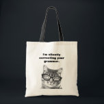 I'm silently correcting your grammar cat tote bag<br><div class="desc">I'm silently correcting your grammar teacher tote bag. Funny animal print design with humourous quote. Cute idea for english teacher and school class room. The grammar police is here! Geek fun / teaching humour. Nerdy cat / kitten with glasses.</div>