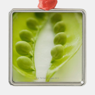 Image of three open pea pods, extreme close-up metal tree decoration