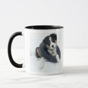 in inner tube in the snow mug