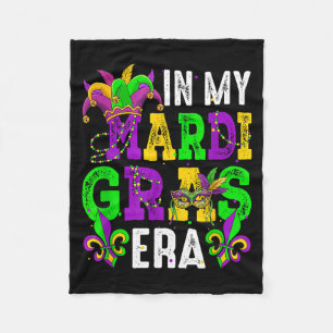 In mardi gras era colorful beads masked jester hat fleece blanket