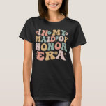In My Maid of Honour Era Groovy Bridesmaid Wedding T-Shirt<br><div class="desc">Retro groovy in my maid of honour era is a perfect present for sister of the best sisters get promoted to maid of honour to celebrate hens night,  bridal shower,  bachelorette parties for sisters. Funny big sister purple and black maid of honour proposal presen</div>