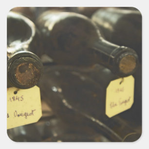 In the underground wine cellar: lying bottles in square sticker