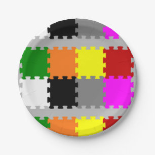Interlocking puzzle pieces on grey paper plate