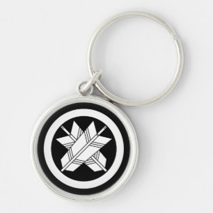 Intersecting arrows in circle key ring