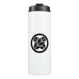 Intersecting hawk feathers in a circle thermal tumbler