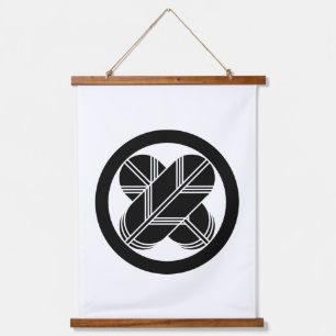 Intersecting hawk feathers in circle hanging tapestry