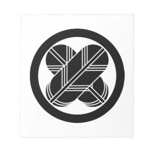 Intersecting hawk feathers in circle notepad