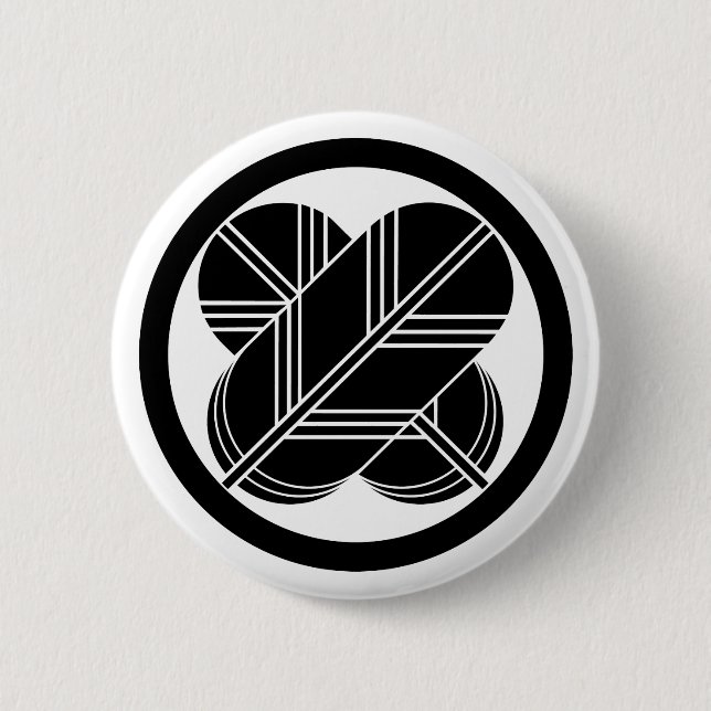 Intersecting hawk feathers with foot in circle 6 cm round badge (Front)