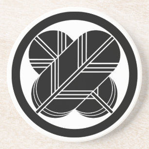 Intersecting hawk feathers with foot in circle coaster