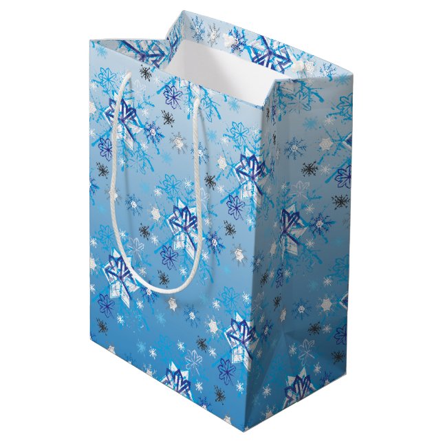 Intricate blue and white stars and snowflakes medium gift bag (Back Angled)