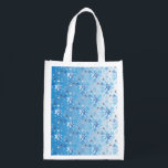 Intricate blue and white stars and snowflakes reusable grocery bag<br><div class="desc">Intricate blue and white stars and snowflakes holiday pattern. Need more? Check out other holiday designs at my store! Cheers! :)</div>