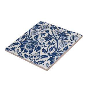 Intricate blue floral pattern on light background tile