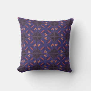 Intricate floral pattern in deep blue and orange cushion