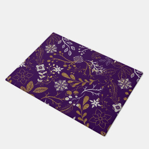 Intricate floral pattern with gold and white doormat