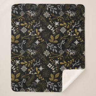 Intricate floral pattern with gold and white sherpa blanket