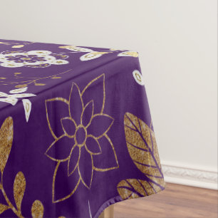 Intricate floral pattern with gold and white tablecloth