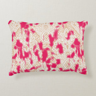 Intricate textile design featuring a rich pink pat decorative cushion