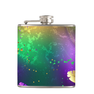 Iridescent mardi gras background with beads hip flask