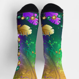 Iridescent mardi gras background with beads socks