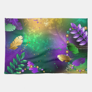 Iridescent mardi gras background with beads tea towel