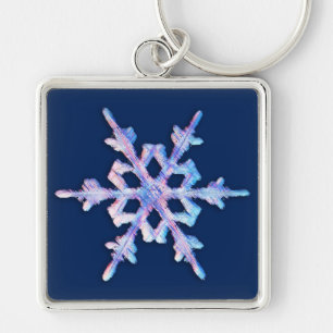Iridescent snowflake on dark blue key ring