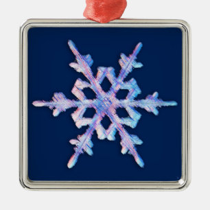 Iridescent snowflake on dark blue metal tree decoration