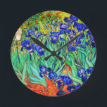 Irises by Vincent Van Gogh Round Clock<br><div class="desc">Vincent Van Gogh Irises . Painted in 1889 it is one of the painting he created in Saint Paul-de-Mausole asylum in Saint-Rémy-de-Provence in France. It is an oil painting. This fine art landscape oil painting depicts a field of iris flower plants. Vincent Van Gogh was a famous artist. He was...</div>
