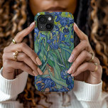 Irises | Vincent Van Gogh iPhone 15 Case<br><div class="desc">Irises (1889) by Dutch post-impressionist artist Vincent Van Gogh. Original landscape painting is an oil on canvas showing a garden of blooming iris flowers. 

Use the design tools to add custom text or personalise the image.</div>