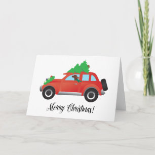 Irish Setter Driving a Car with a tree on top. Holiday Card