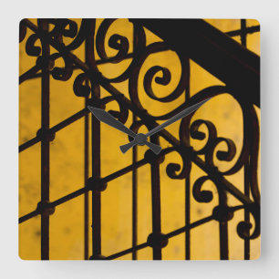 Iron gate pattern in yellow, Cuba Square Wall Clock