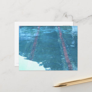 Iron rails laid in the shallows of the sea. postcard