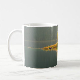 ISLAND SURROUNDED BY WATER COFFEE MUG