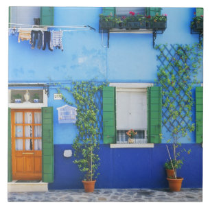 Italy, Burano. A colourful house in Burano near Tile