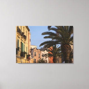 Italy, Sardinia, Cagliari. Buildings and palms Canvas Print