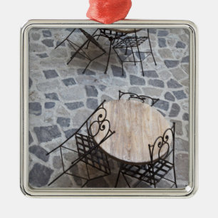 Italy, Sardinia, Castelsardo. Cafe tables. Metal Tree Decoration