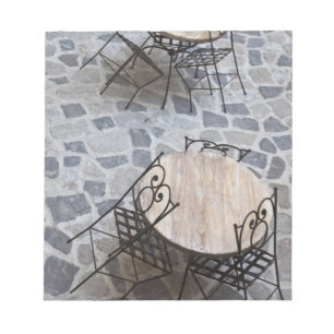 Italy, Sardinia, Castelsardo. Cafe tables. Notepad