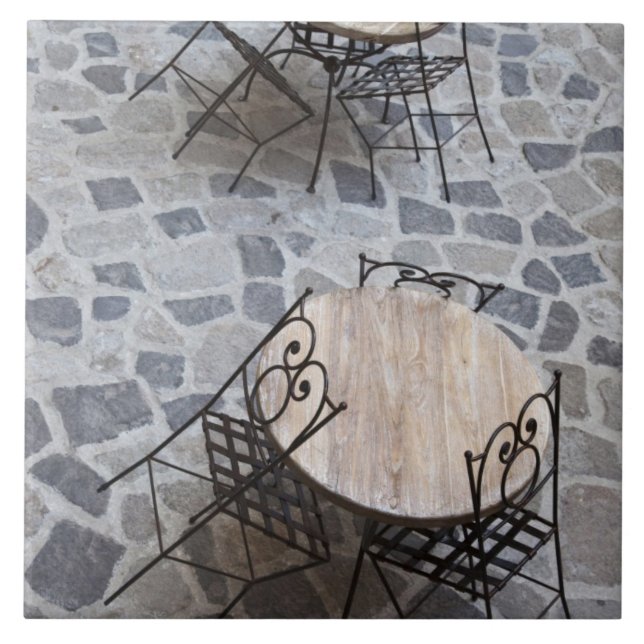 Italy, Sardinia, Castelsardo. Cafe tables. Tile (Front)