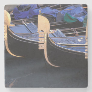 Italy, Veneto, Venice. Row of Gondolas. Stone Coaster