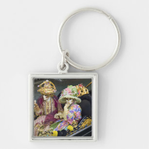 Italy, Venice. Couple dressed in costumes for Key Ring