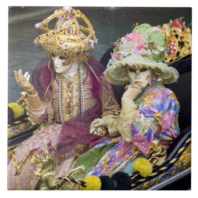 Italy, Venice. Couple dressed in costumes for Tile (Front)